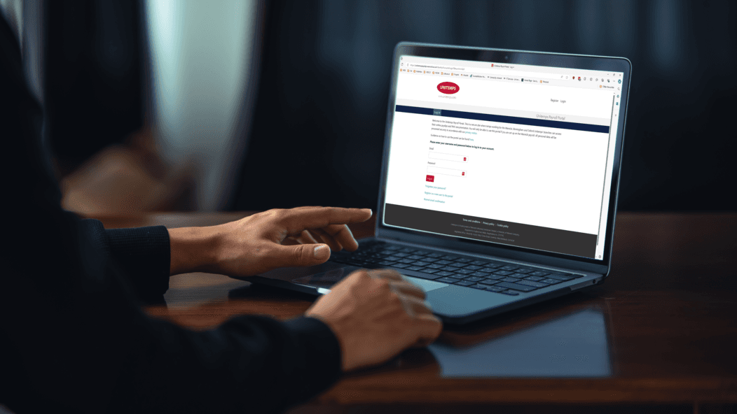 Screenshot of WEG Payroll Bureau on a laptop