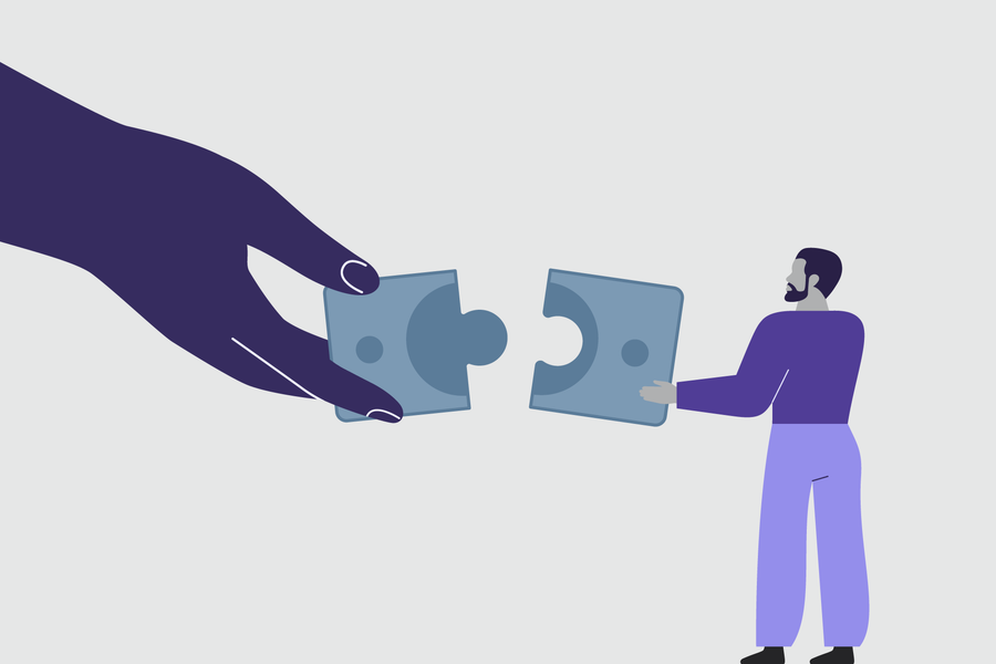 Hands fitting puzzle pieces together, representing integrated higher education solutions